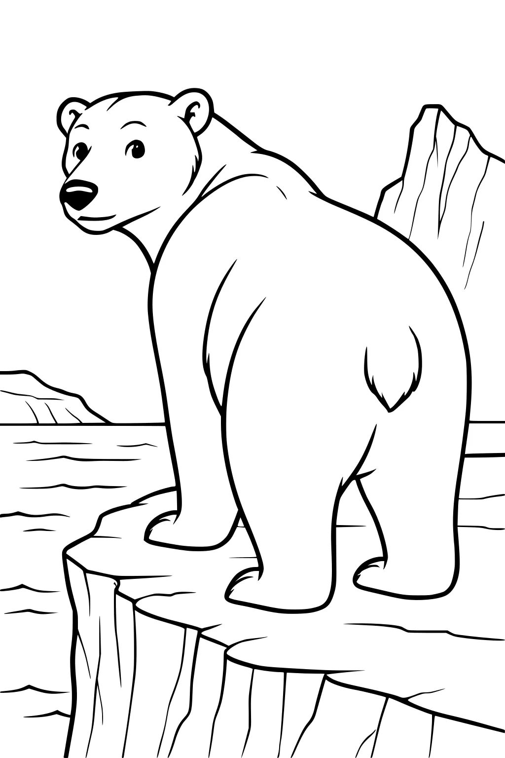 Polar bear stands on icy cliff by the water, mountains rising in the background, looking back over his shoulder.